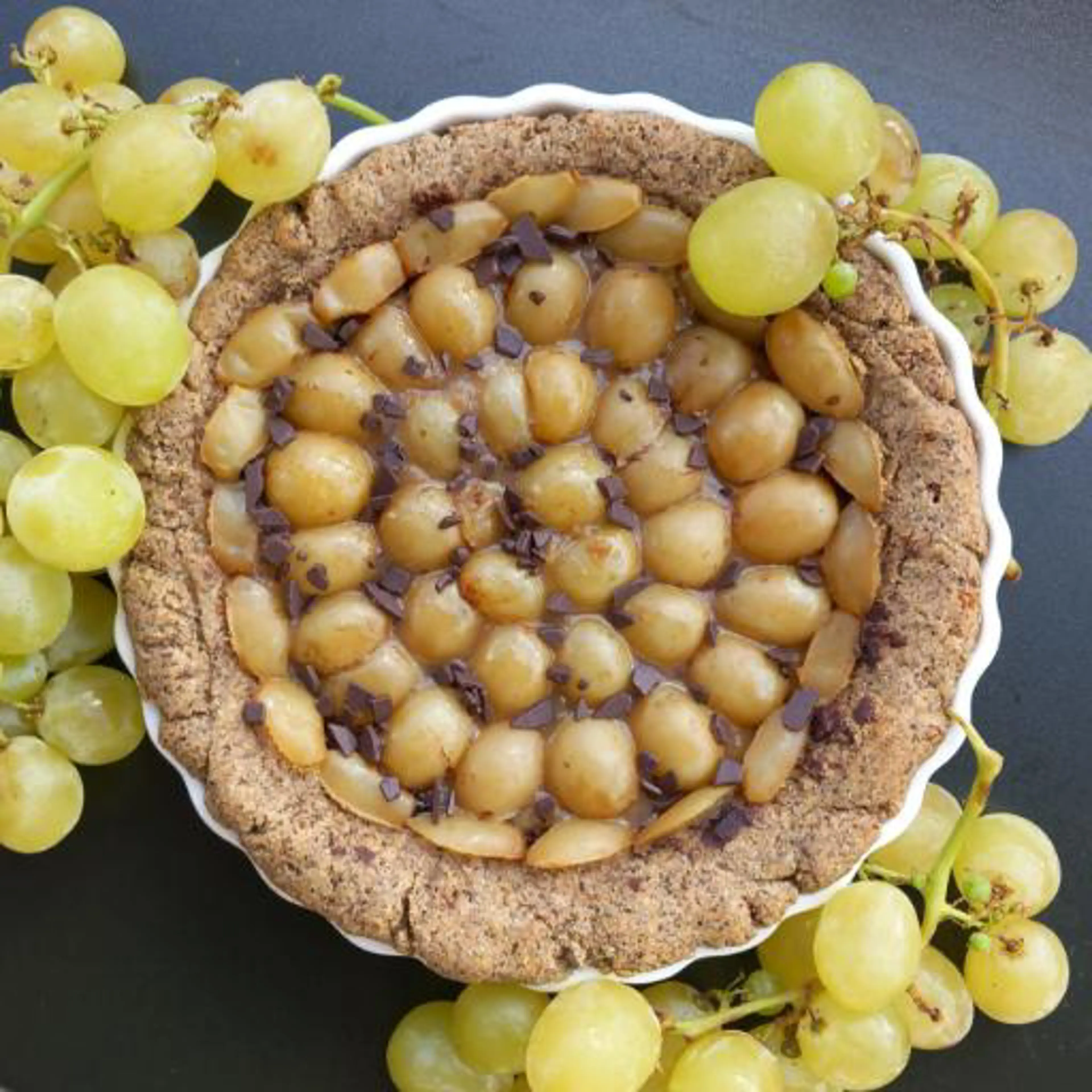 Buckwheat, grape and chocolate tart