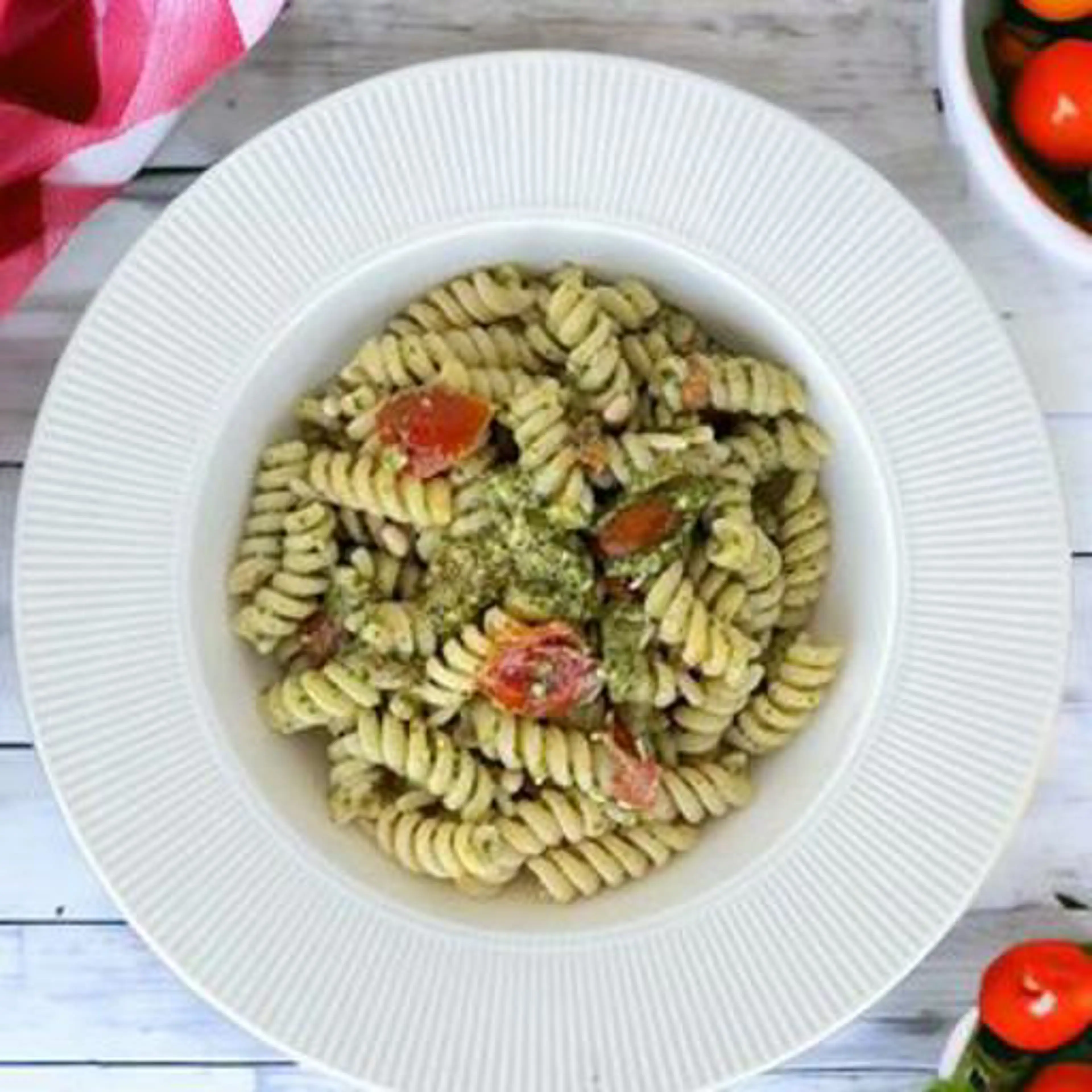 Fusilli with arugula pesto and cherry tomatoes