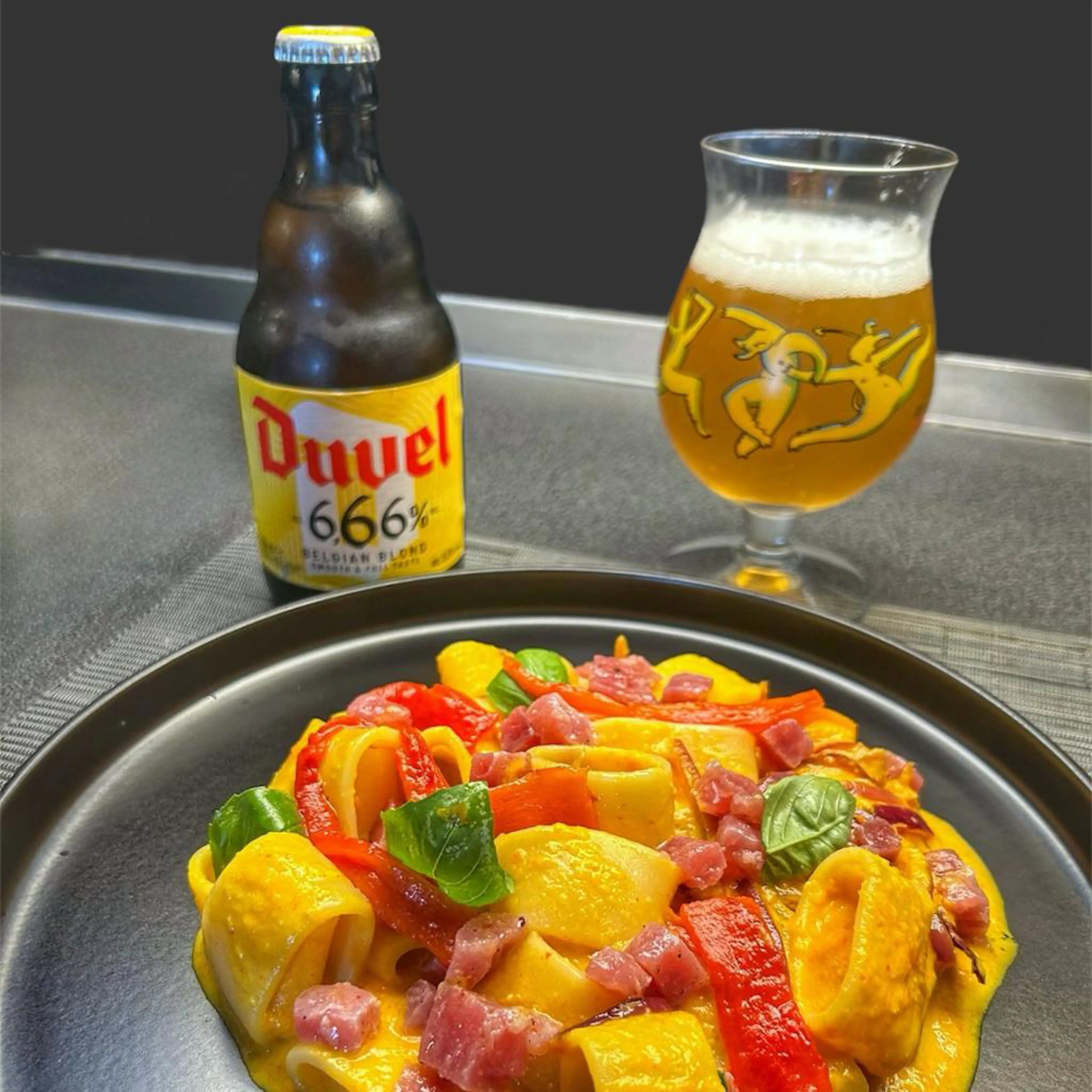 Calamarata with roasted pepper sauce, caramelized onions and red tuna tartare