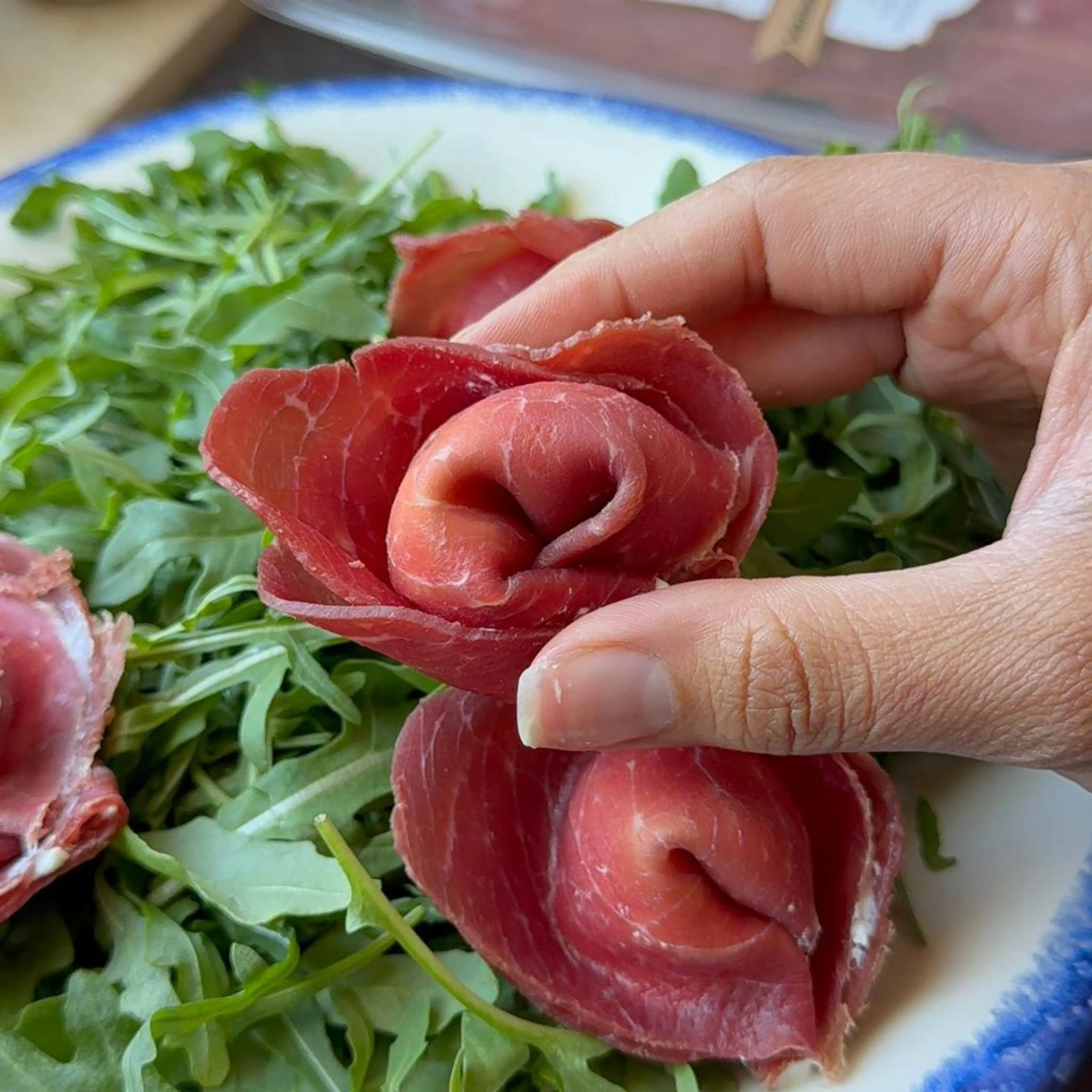Bresaola tortelloni with stracciatella and raspberry