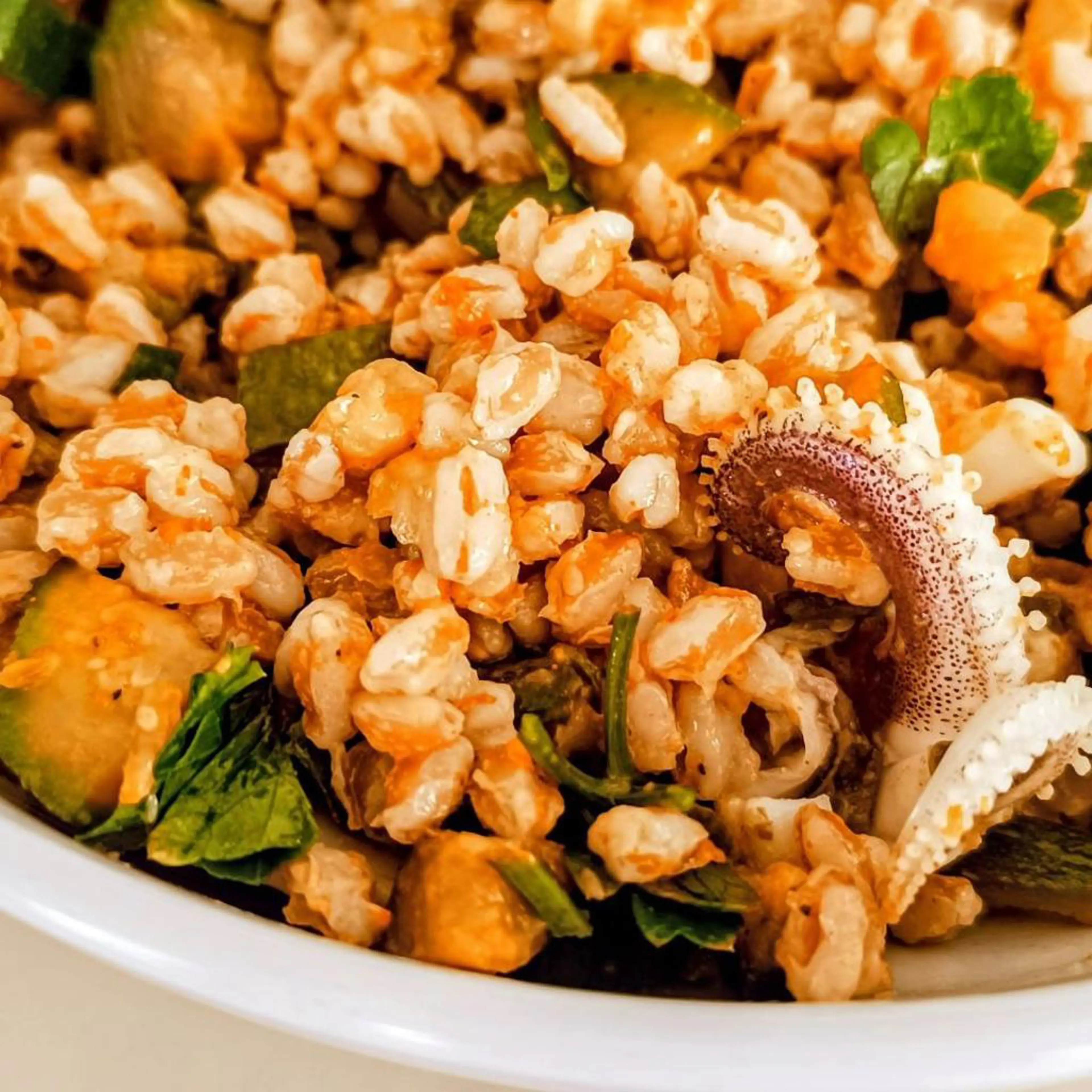 Spelt with zucchini and squid