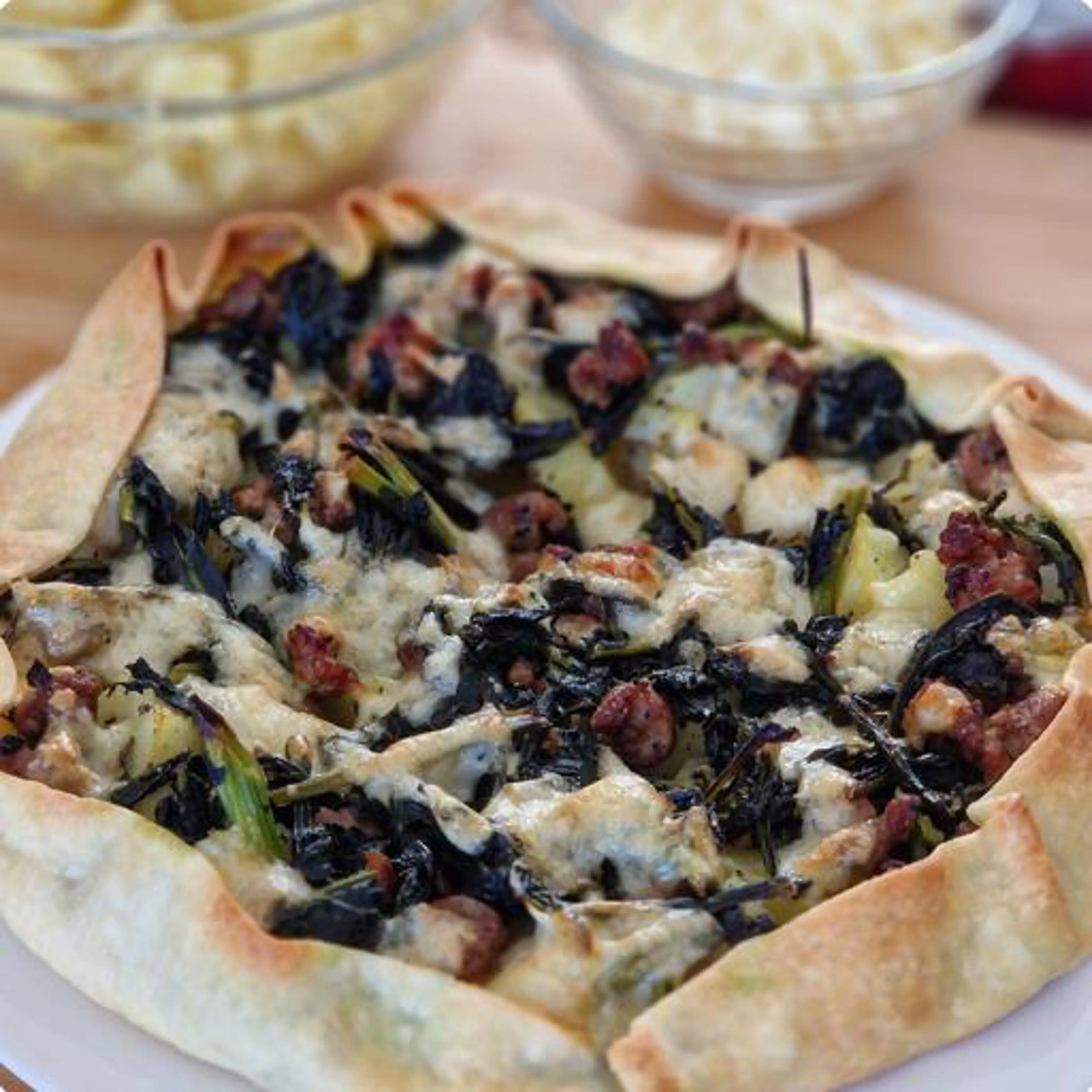 Savory tart with black kale, potatoes and sausage
