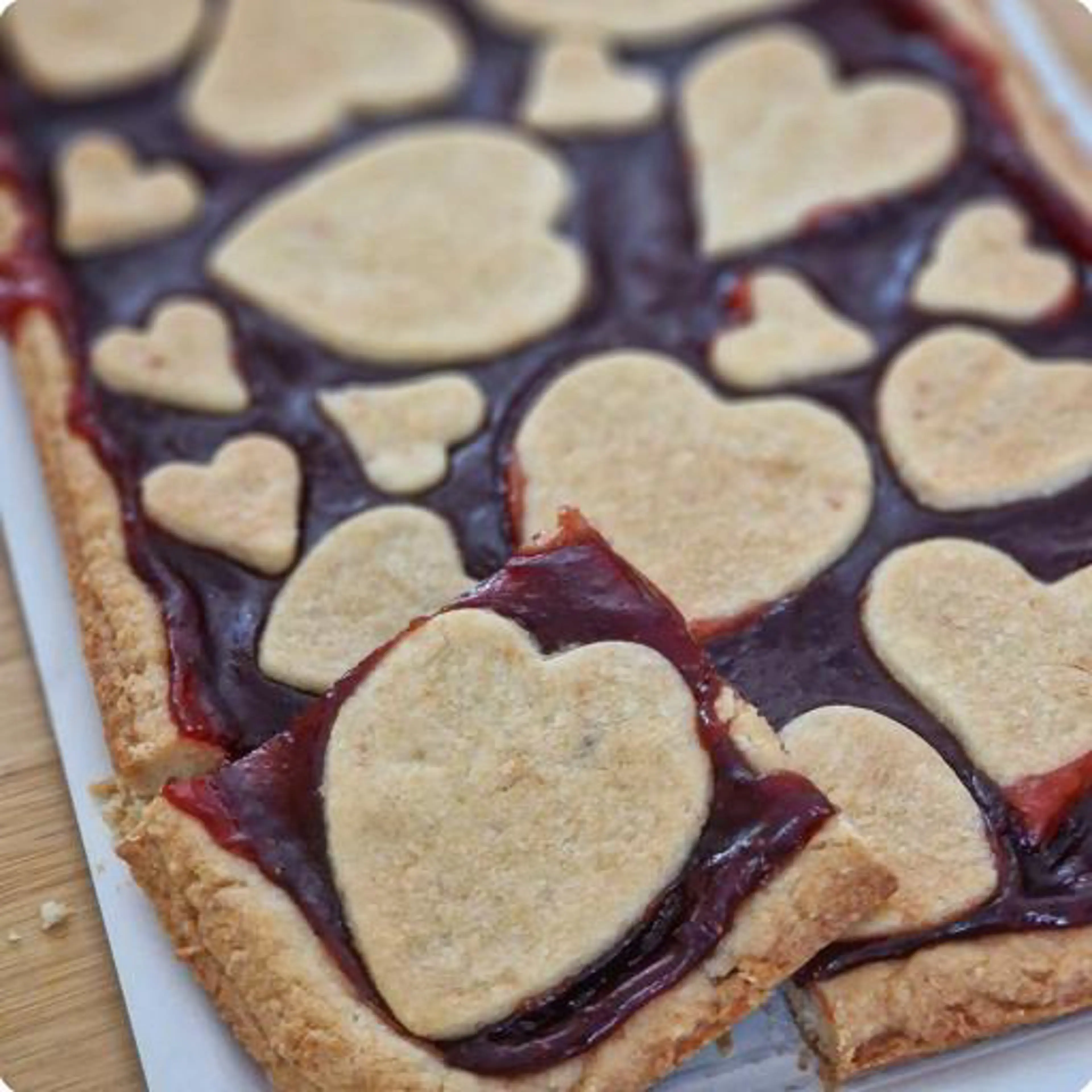 Heart-shaped tart with strawberry jam