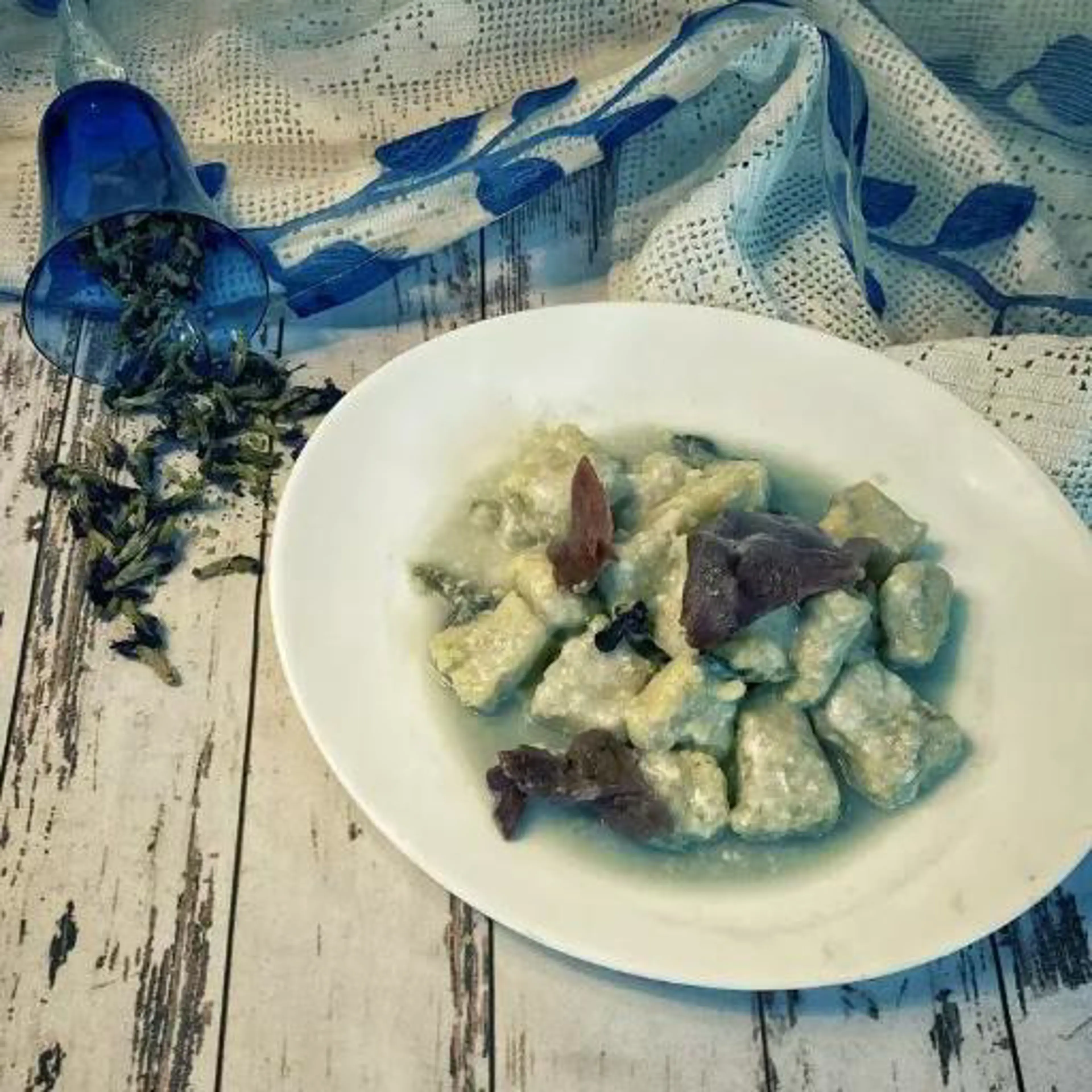 Blue gnocchi with pecorino cream