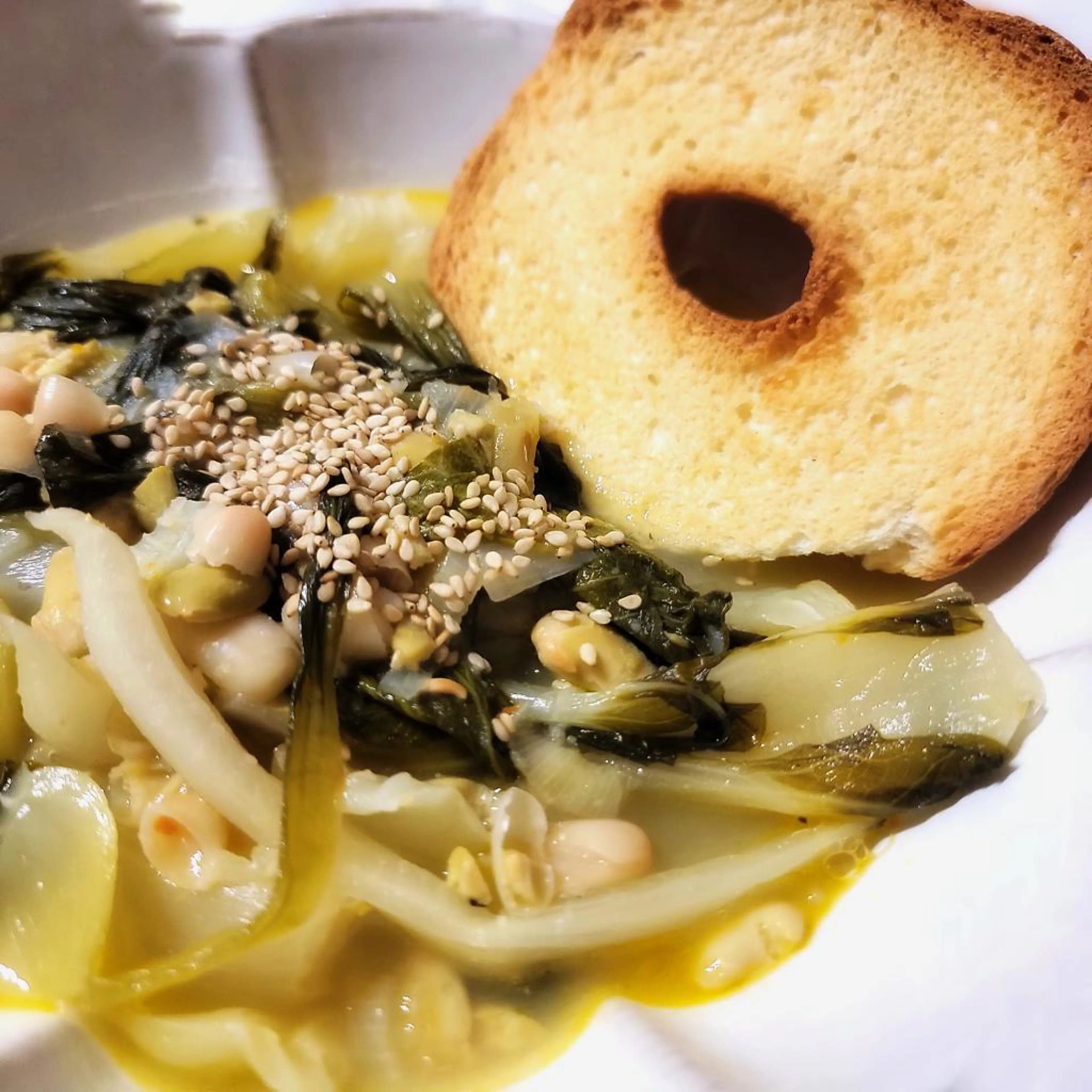 Pak choi soup with edamame and cannellini beans