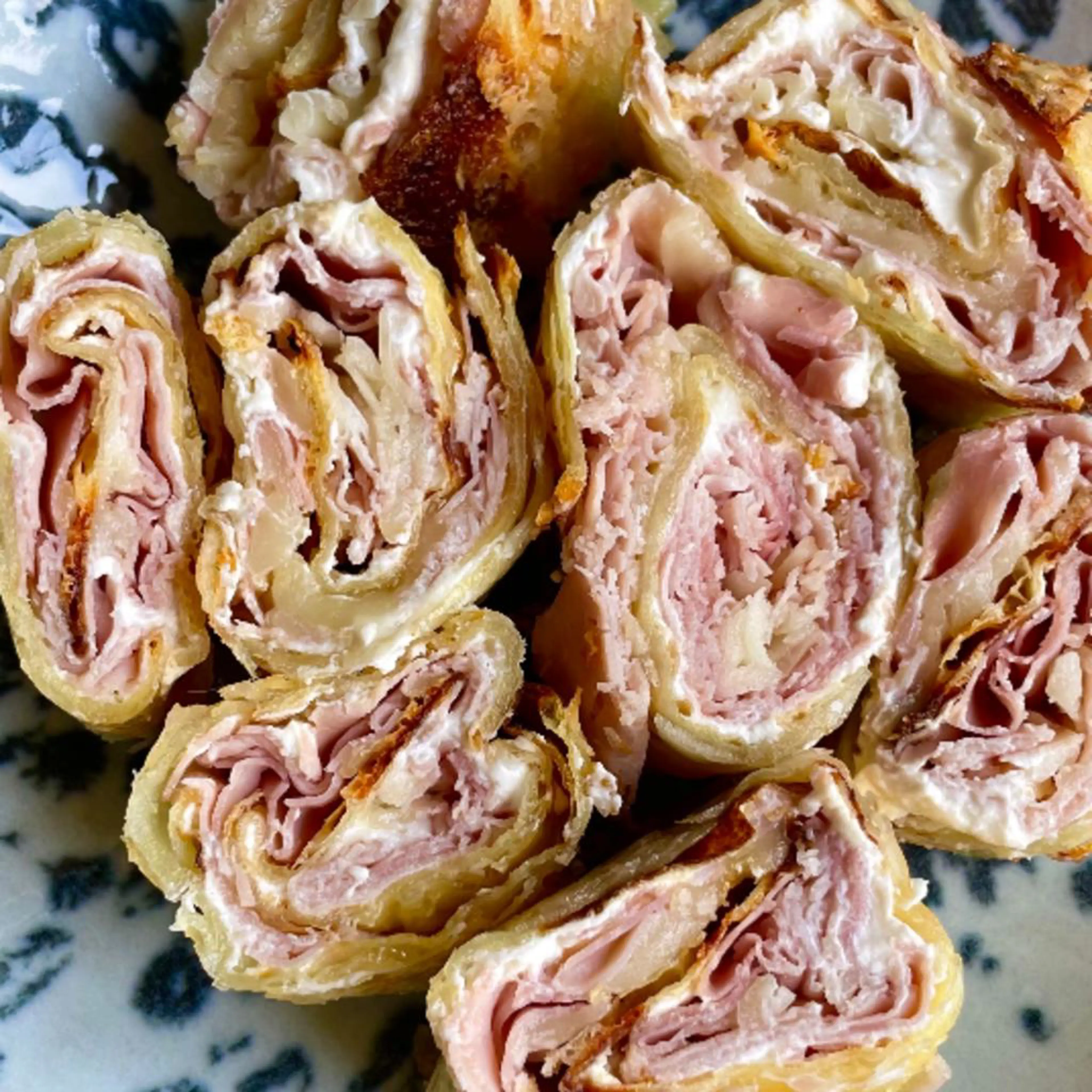 Crispy potato roll filled with cooked ham and provola