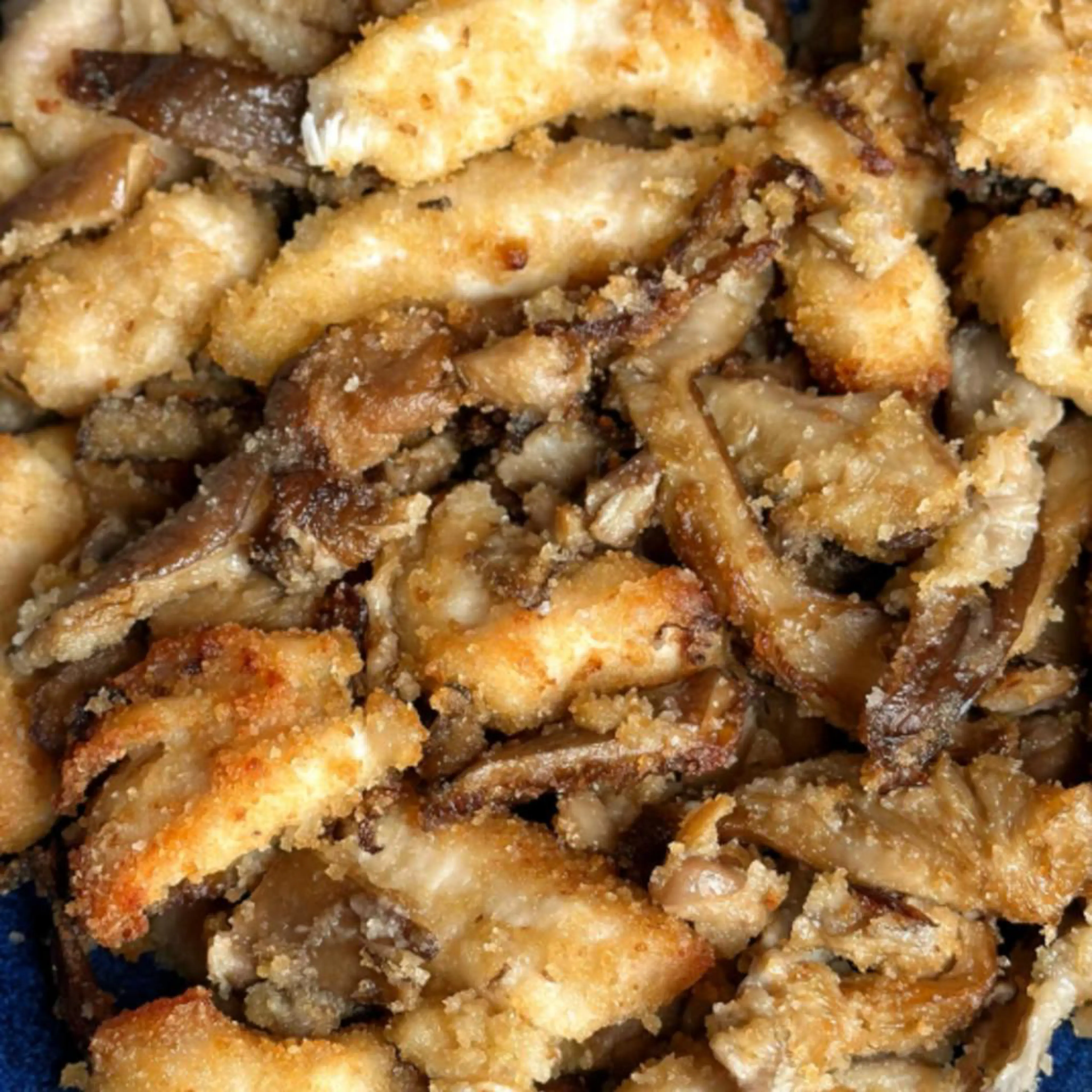 Gratinated chicken strips and mushrooms