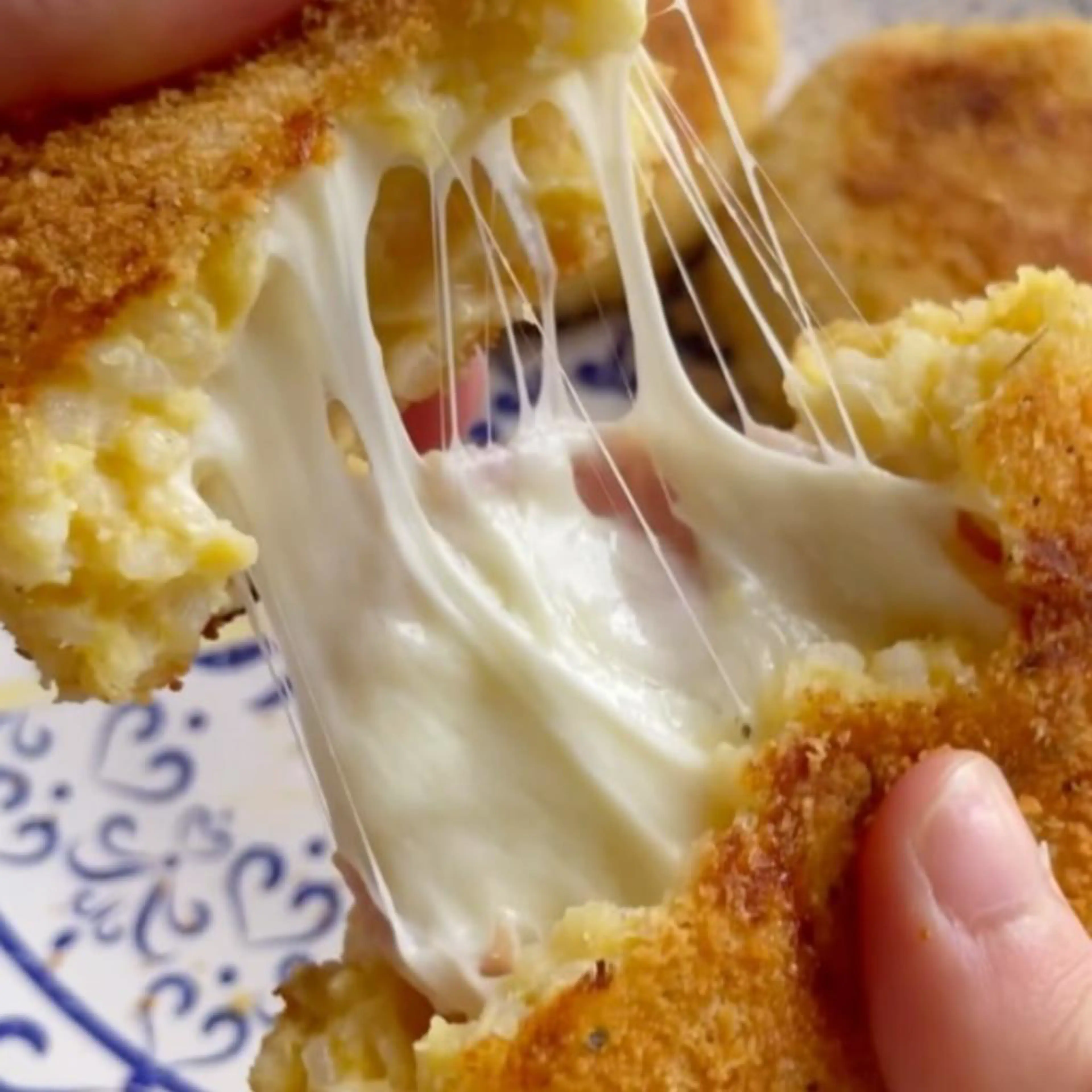 Rice croquettes stuffed with ham and cheese, pan-cooked