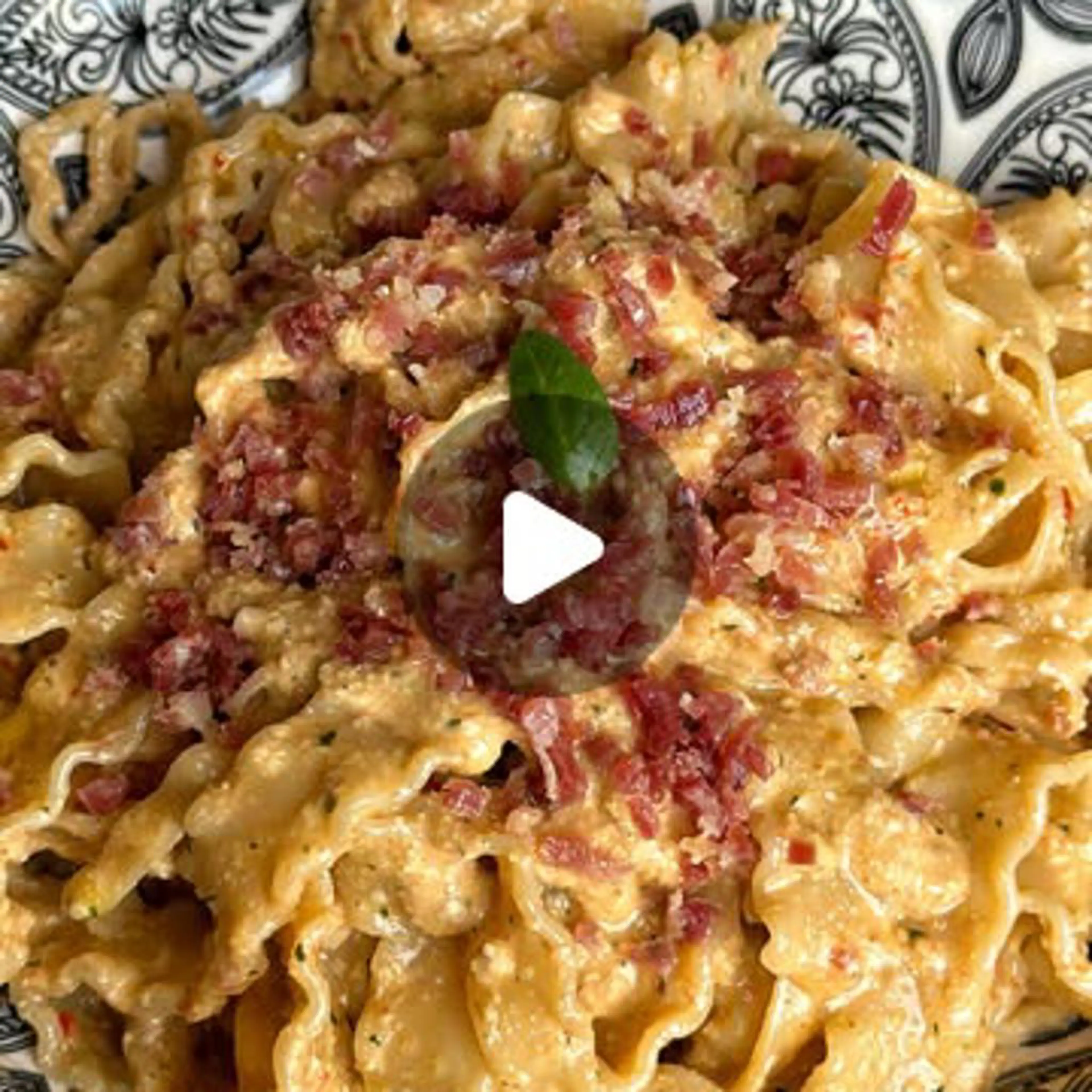 Pasta bows with walnut pesto, sun-dried tomatoes and pancetta