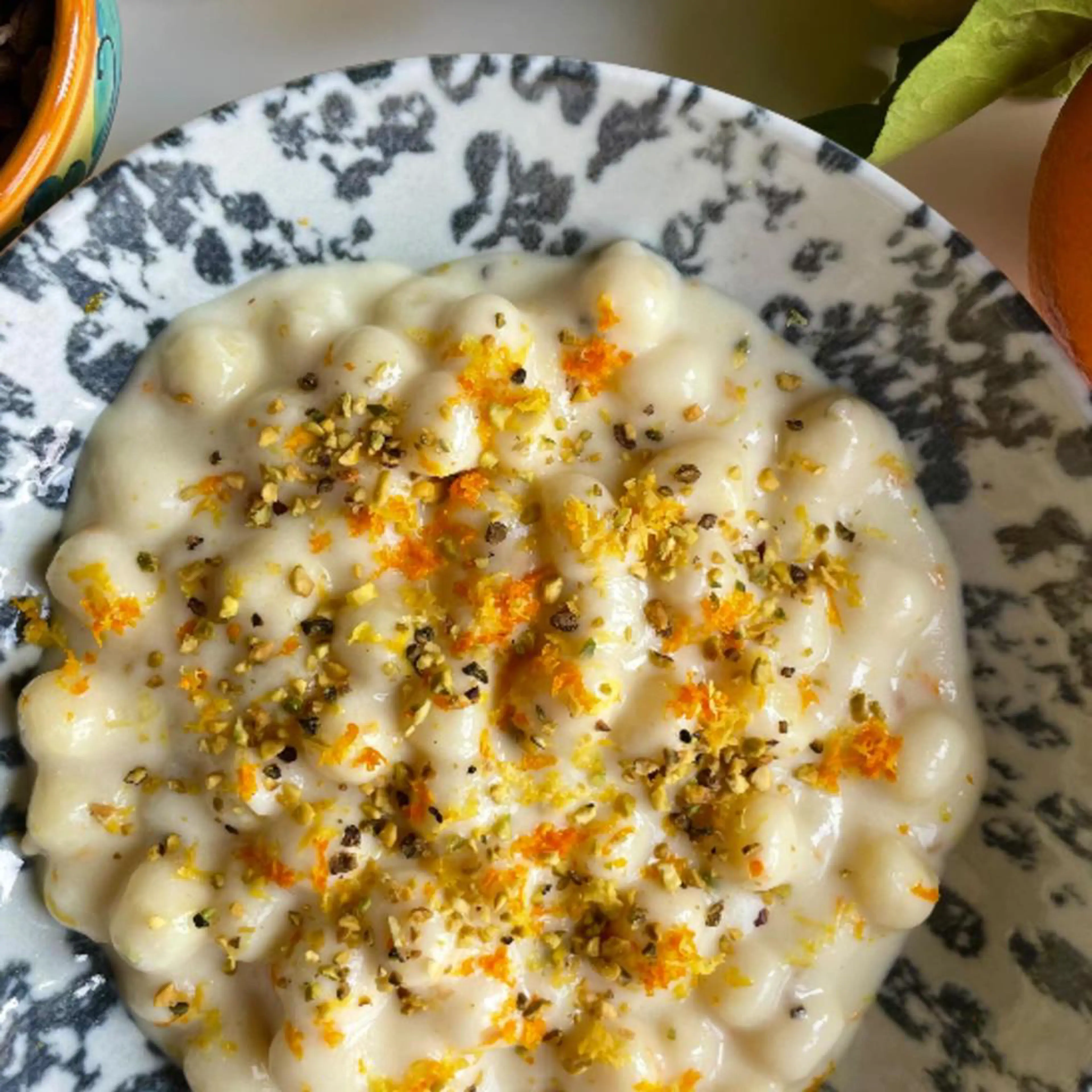 One-pot potato gnocchi with Grana Padano cream, citrus zest and chopped pistachios