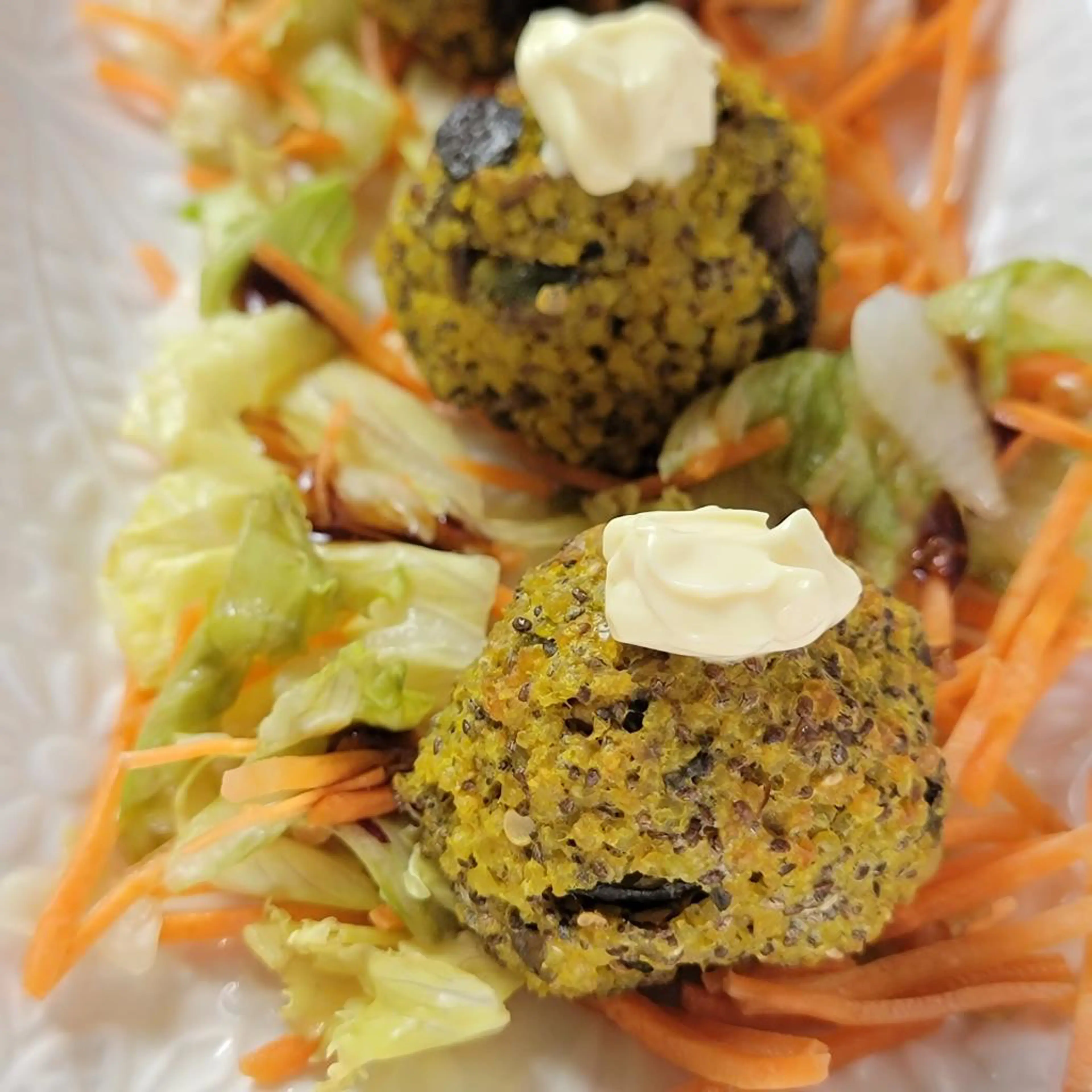 Millet meatballs with vegetables, chickpeas and curry