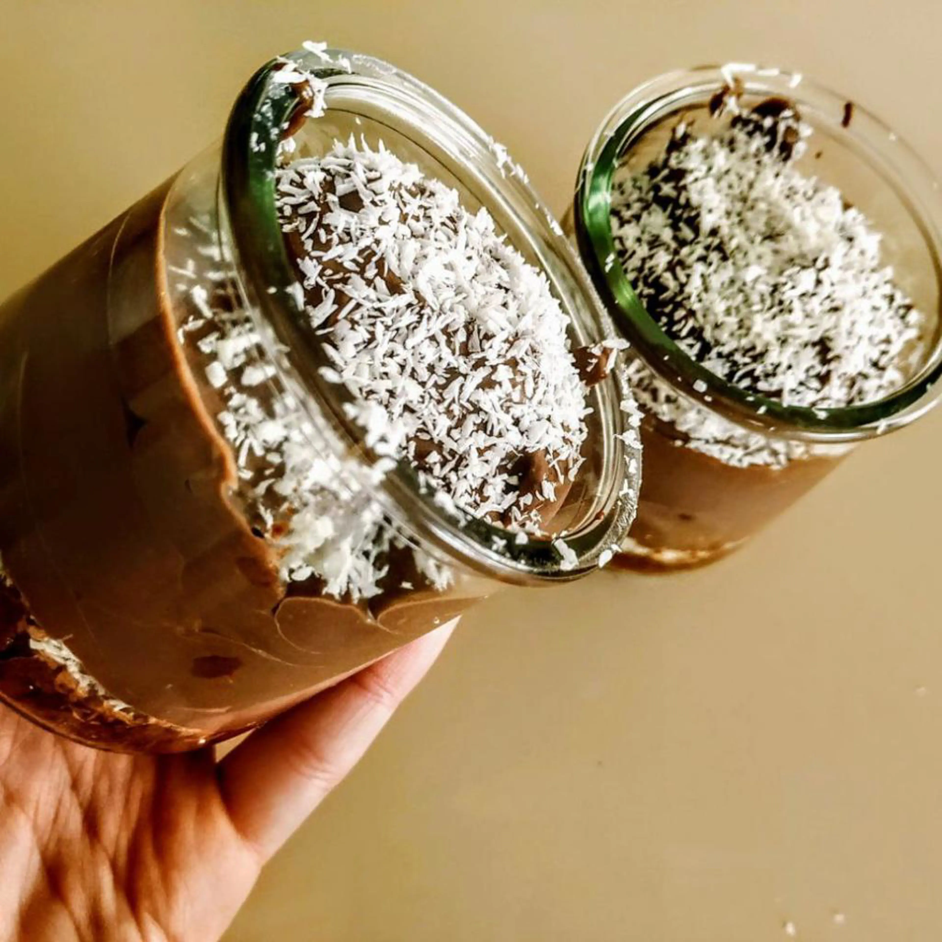 Yogurt and cocoa mousse with chocolate biscuits and shredded coconut